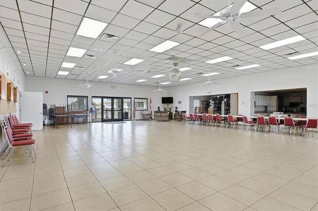 a view of swimming pool with outdoor seating and plants