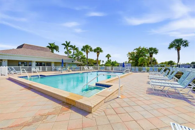 an aerial view of a house with lake view