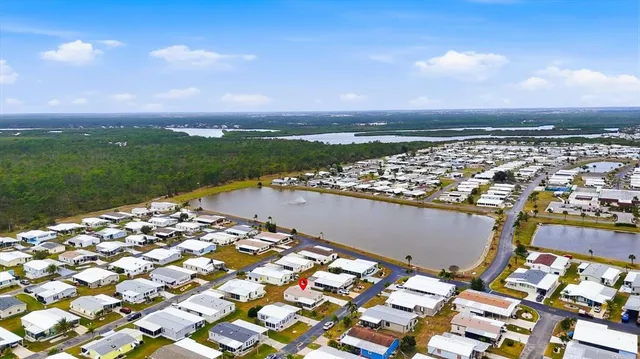 an aerial view of residential houses with city view