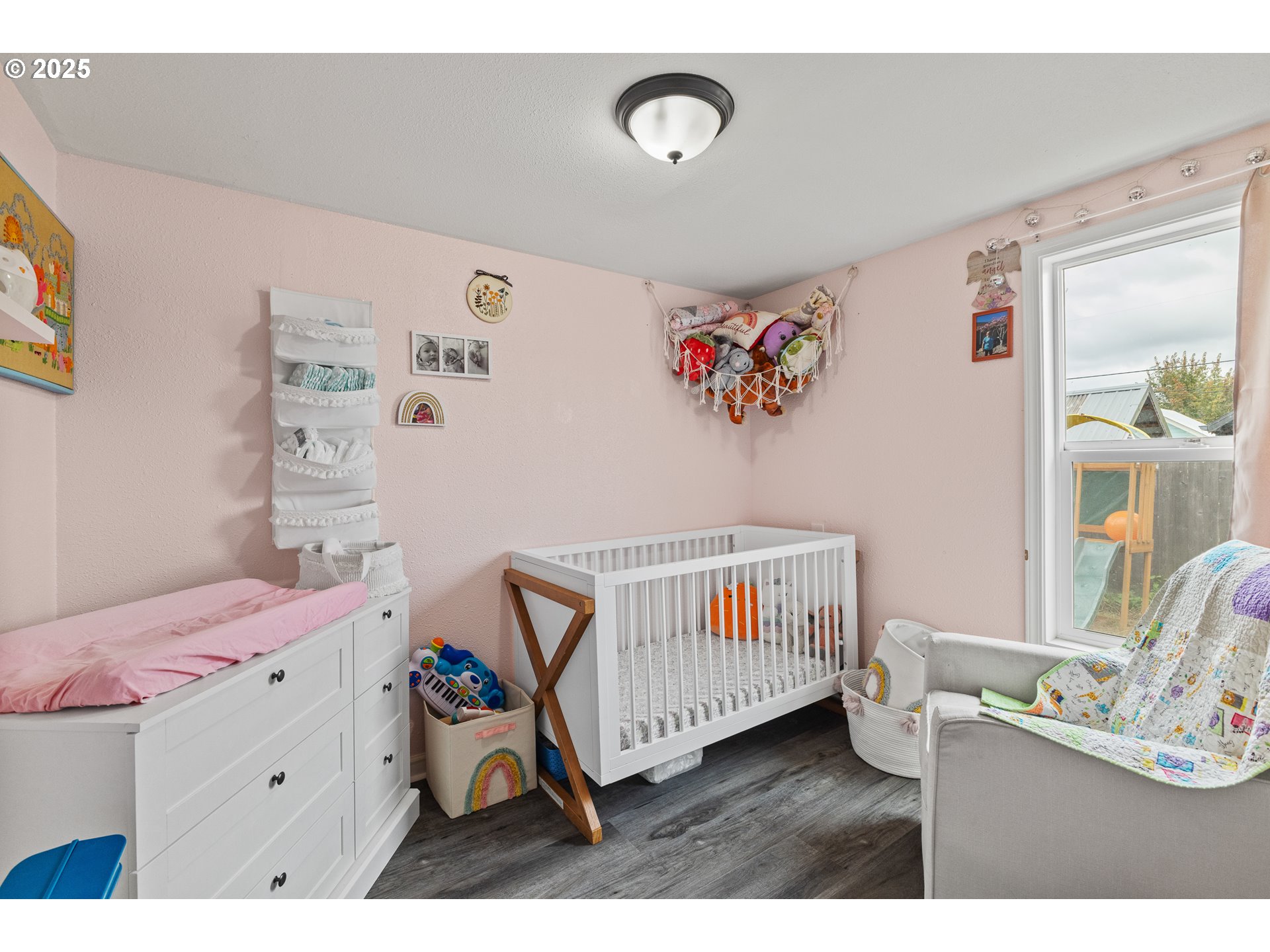 1434 Maryland Avenue Myrtle Point, OR 97458 - Photo 14 of 24 a bedroom with a baby bed baby crib and a dresser in it