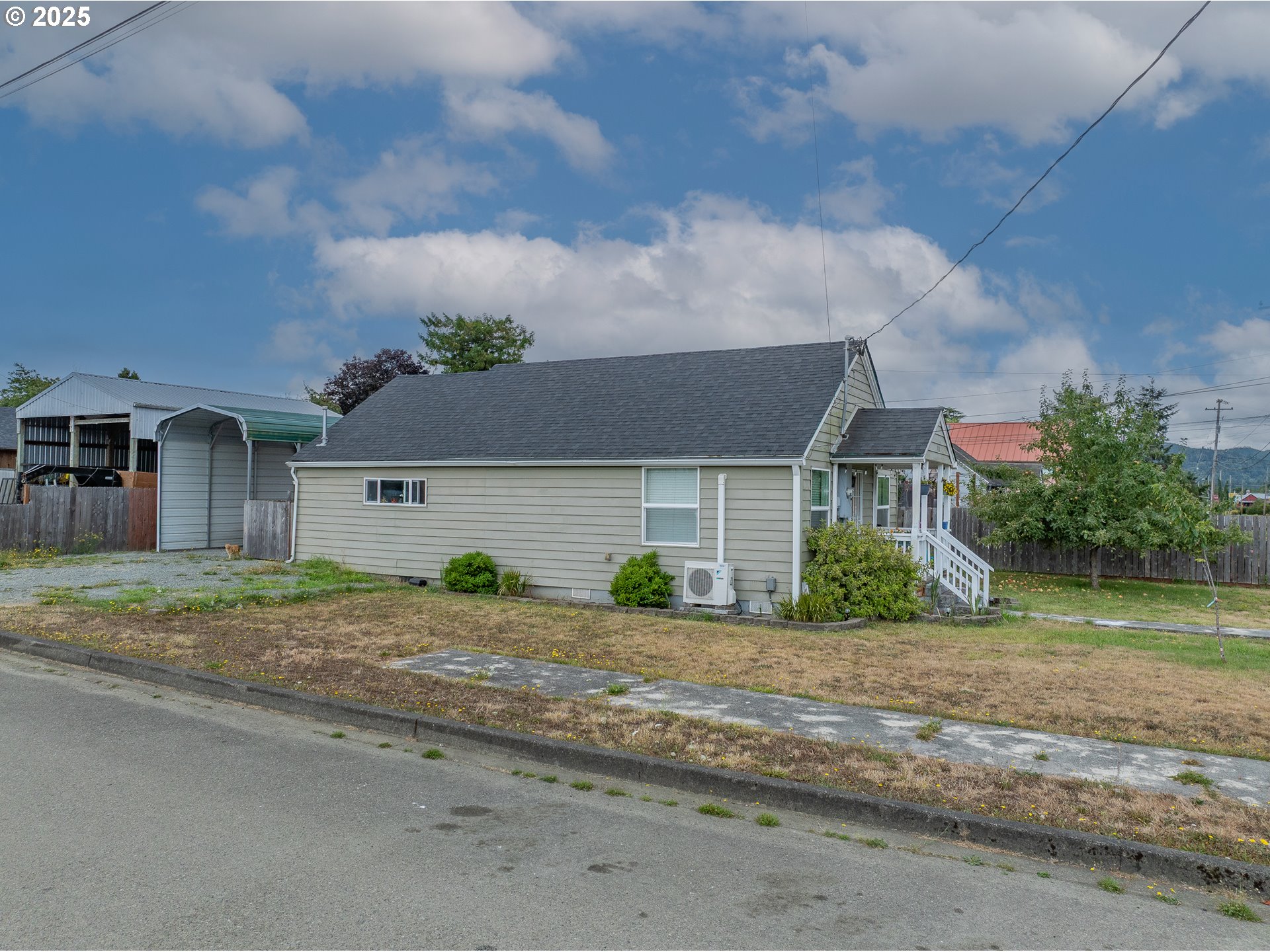 1434 Maryland Avenue Myrtle Point, OR 97458 - Photo 15 of 24 a front view of a house with a yard and a garage