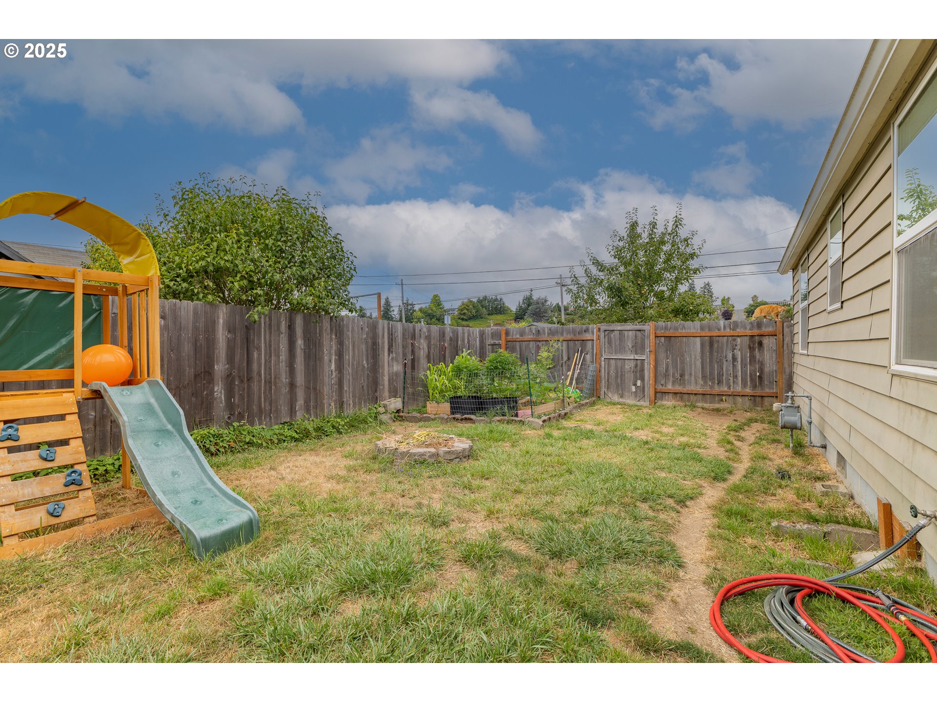 1434 Maryland Avenue Myrtle Point, OR 97458 - Photo 19 of 24 a view of a backyard with a slide