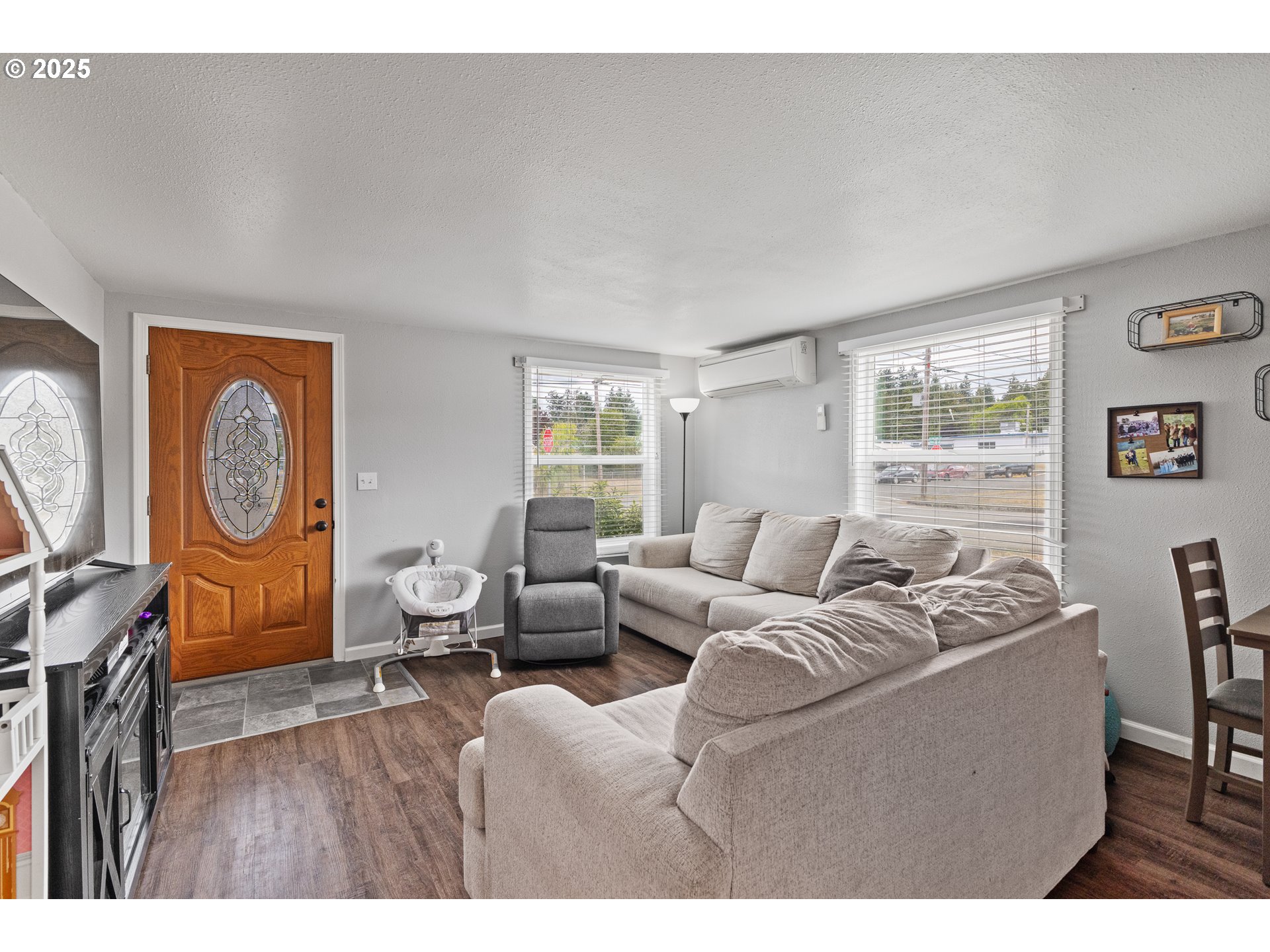 1434 Maryland Avenue Myrtle Point, OR 97458 - Photo 4 of 24 a living room with furniture a window and wooden floor