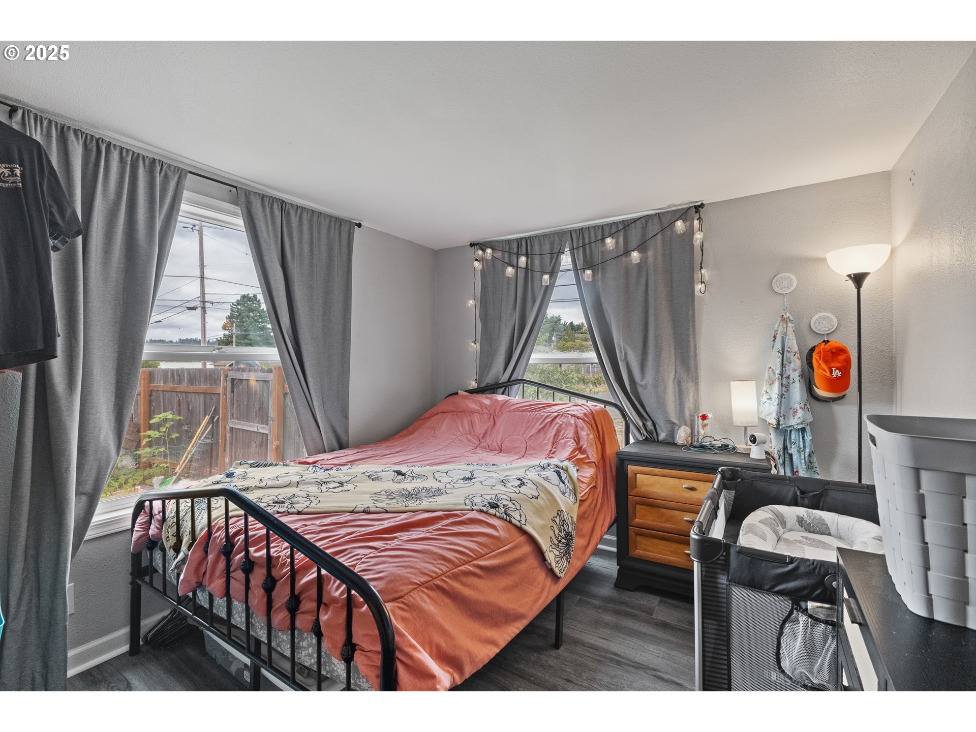 1434 Maryland Avenue Myrtle Point, OR 97458 - Photo 10 of 24 a bedroom with a bed a window and walk in closet
