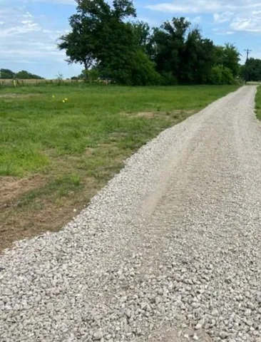 a view of a field with a yard