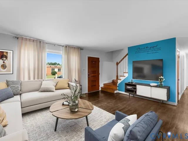 a view of a kitchen with wooden floor and electronic appliances