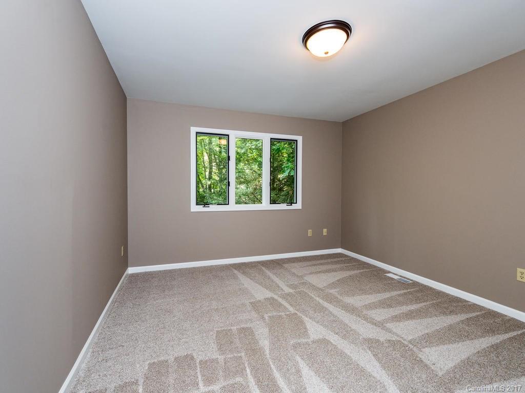 107 Old Distillery Road Hendersonville, NC 28739 - Photo 13 of 24 an empty room with a window