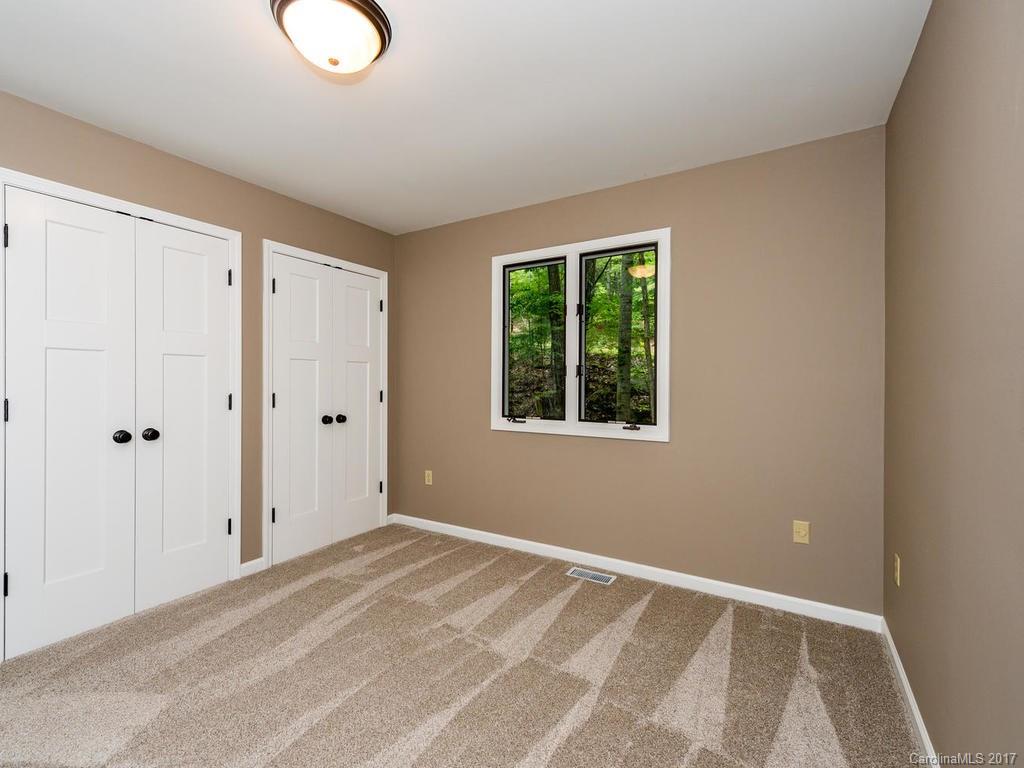 107 Old Distillery Road Hendersonville, NC 28739 - Photo 14 of 24 a view of a livingroom with a window