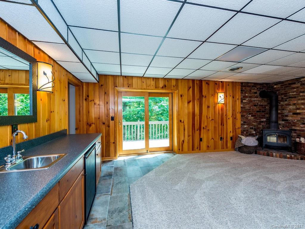 107 Old Distillery Road Hendersonville, NC 28739 - Photo 16 of 24 a spacious bedroom with a large bed and a large window