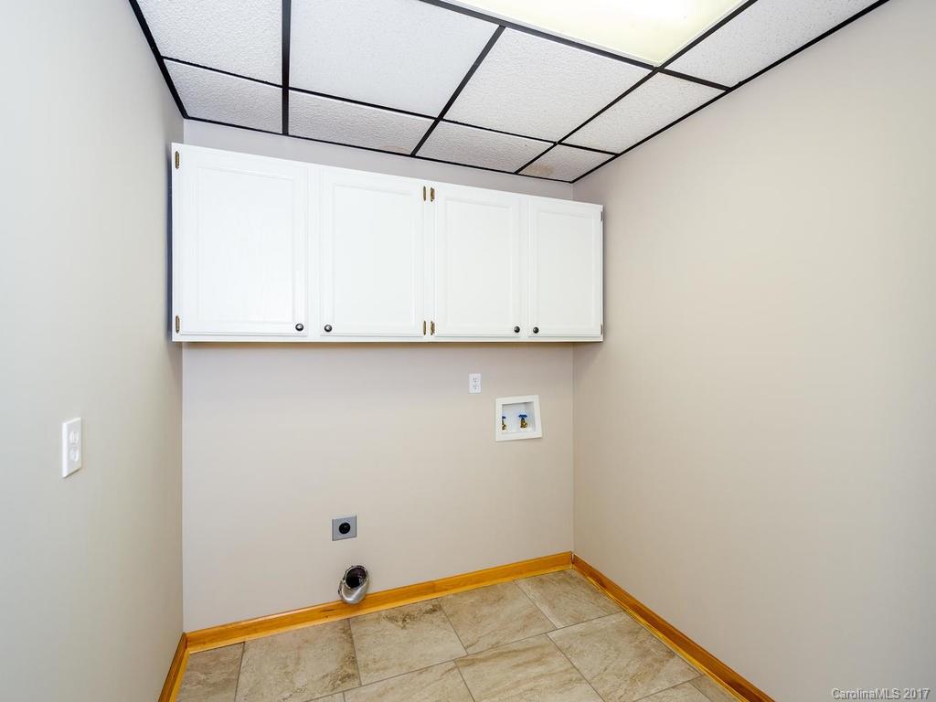 107 Old Distillery Road Hendersonville, NC 28739 - Photo 20 of 24 a view of a room with rack on the wall