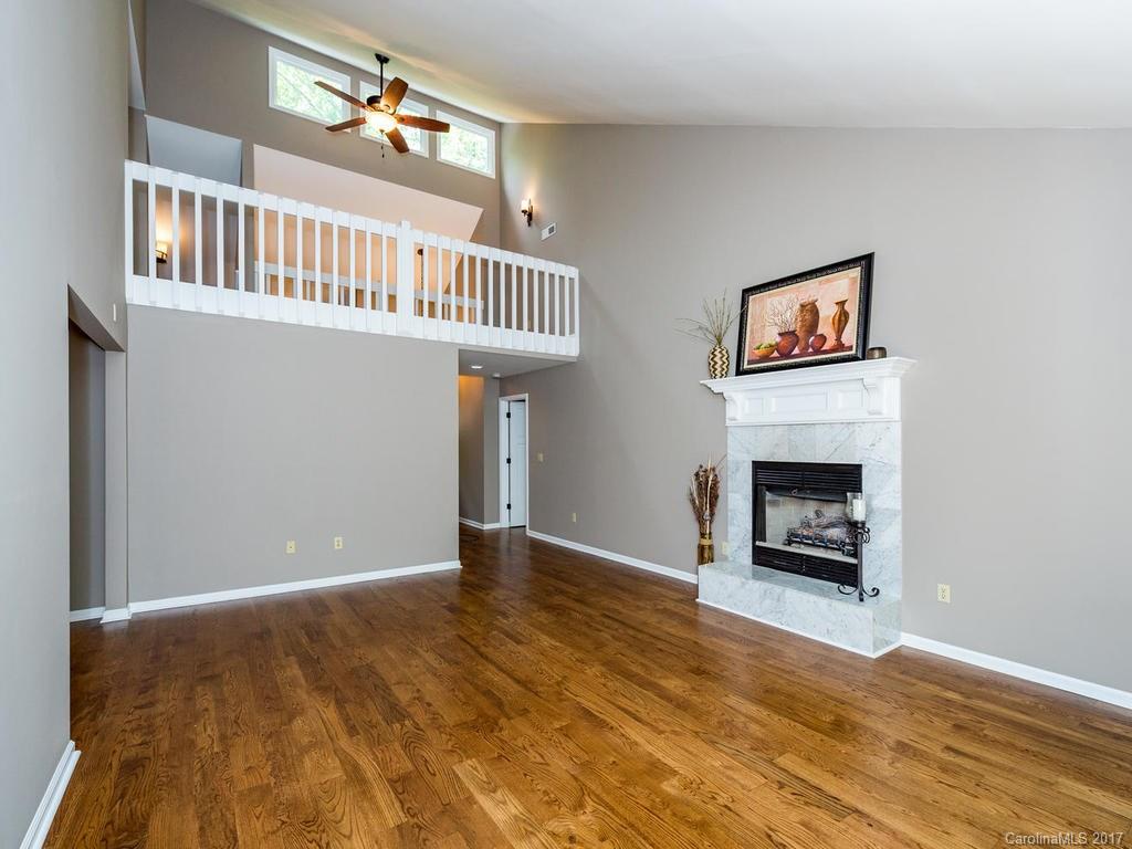 107 Old Distillery Road Hendersonville, NC 28739 - Photo 3 of 24 a view of livingroom with furniture and fireplace