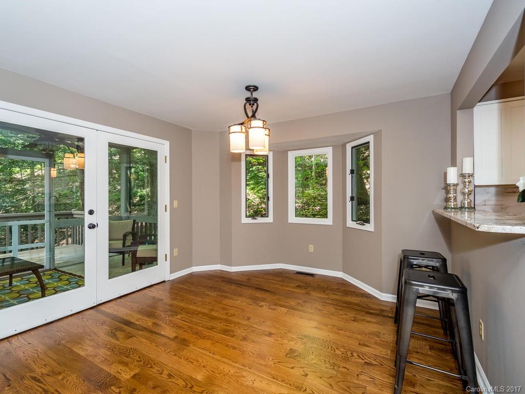 107 Old Distillery Road Hendersonville, NC 28739 - Photo 4 of 24 a view of an empty room with a window