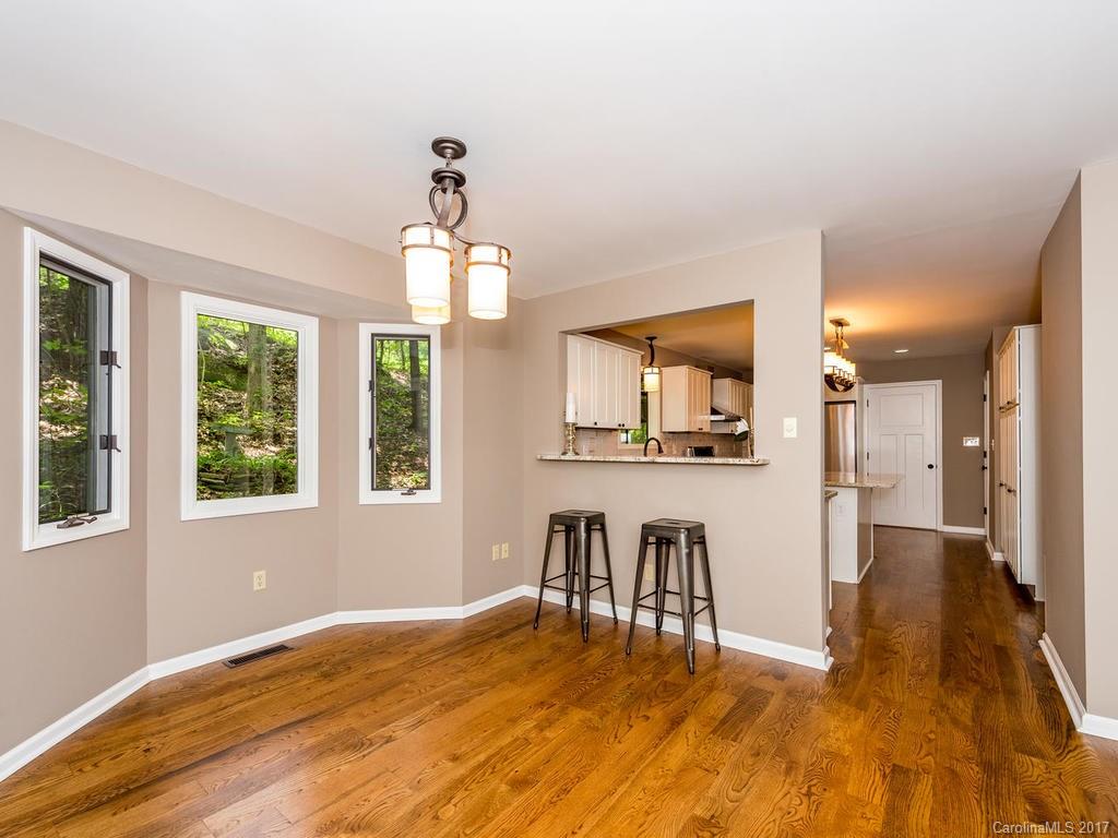 107 Old Distillery Road Hendersonville, NC 28739 - Photo 5 of 24 a view of livingroom with hardwood floor and a ceiling fan
