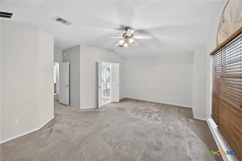 a view of empty room with fan