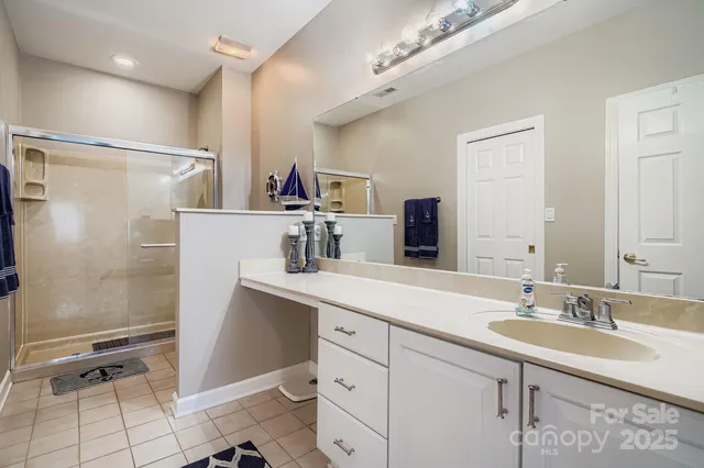 a bathroom with a sink double vanity and a mirror