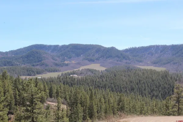 a view of mountains and valleys