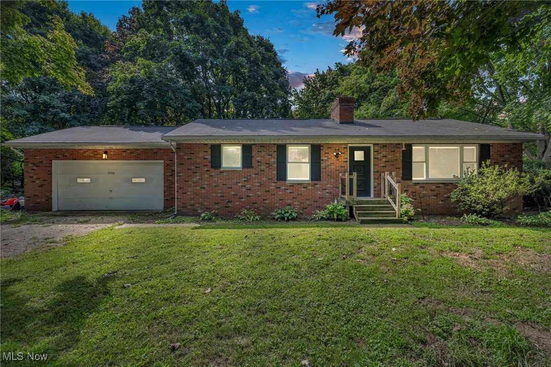 5306 Lockwood Road Madison, OH 44057 - Photo 2 of 28 Single story home featuring a garage and a yard