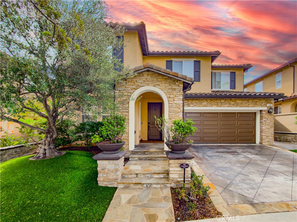 154 Treehouse Irvine, CA 92603 - Photo 1 of 1 a front view of a house with garden
