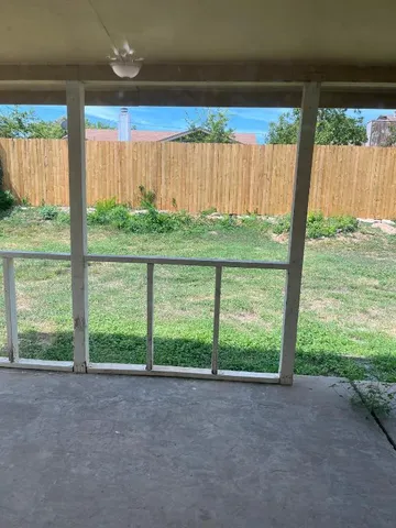 a view of backyard with green space