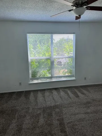a view of a room that has a window in it