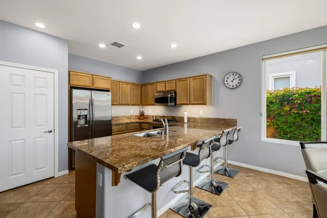 a bedroom with a bed and a night stand