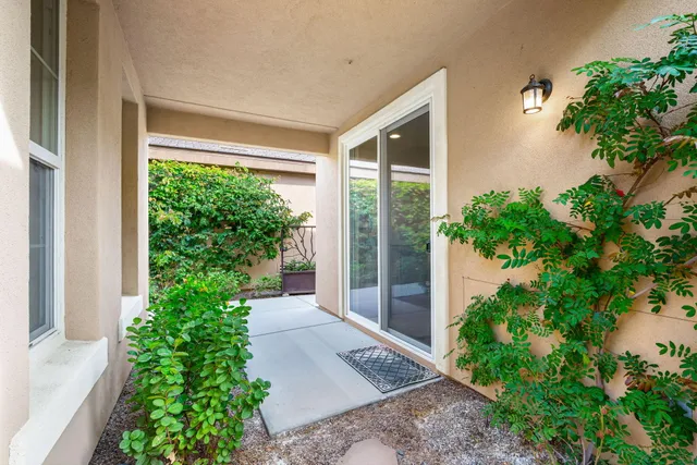 a kitchen with stainless steel appliances granite countertop a refrigerator a stove top oven a sink and dishwasher