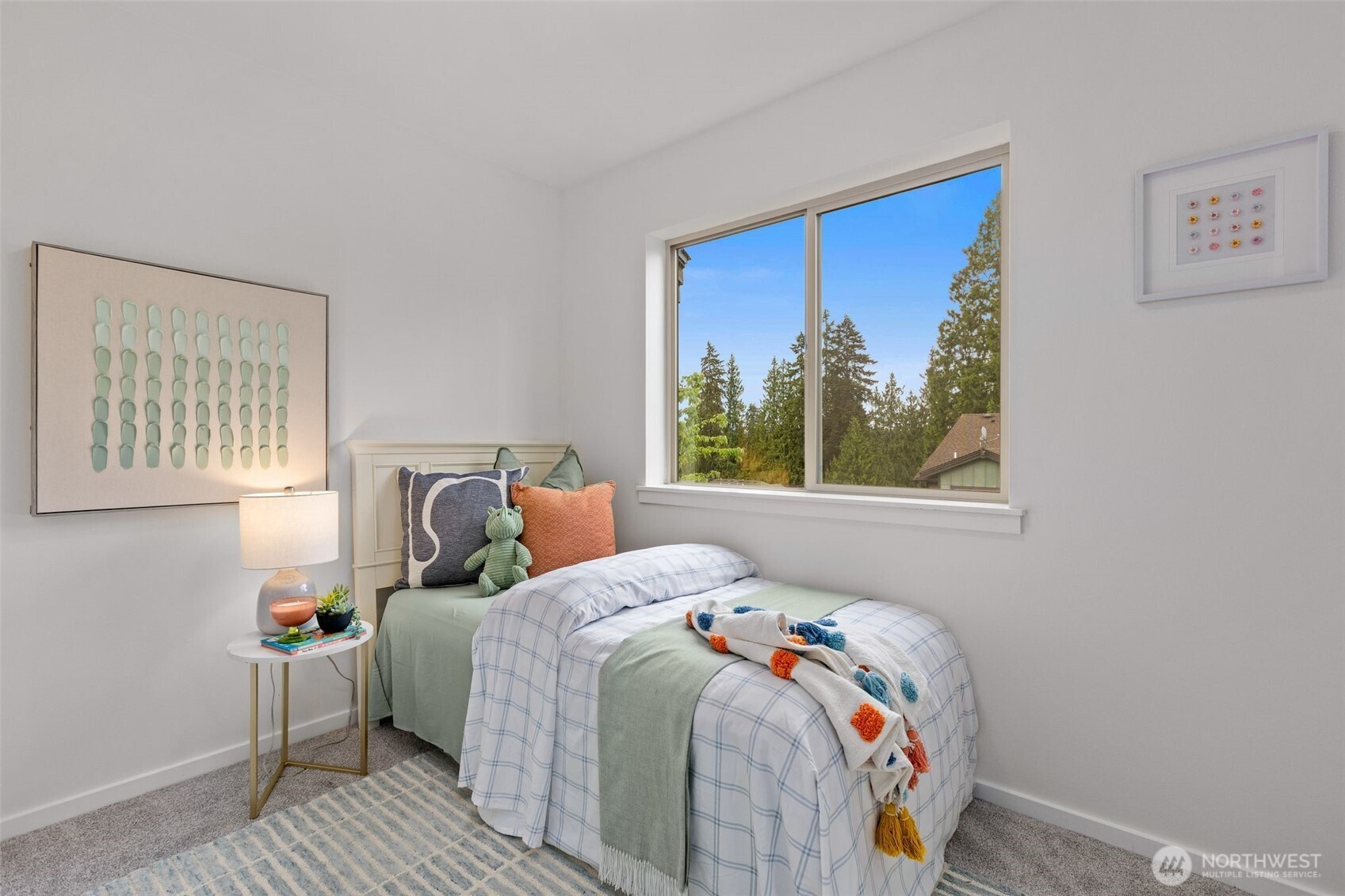16516 2nd Park Southeast Bothell, WA 98012 - Photo 27 of 39 a bed sitting in a bedroom next to a window