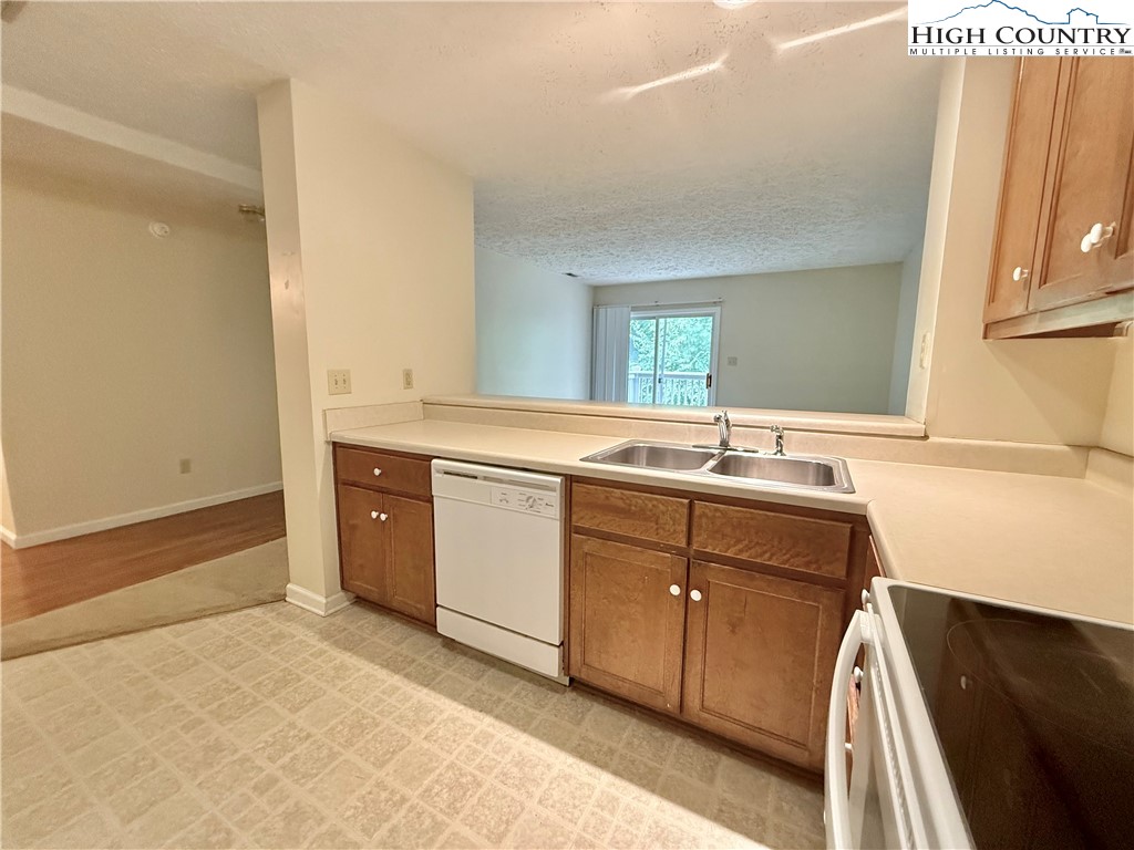 800 Meadowview Drive, Unit 17 Boone, NC 28607 - Photo 11 of 26 a room with a sink and a mirror