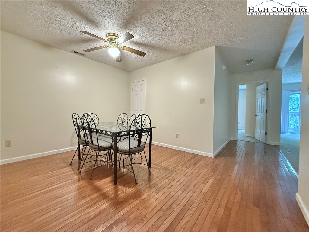 800 Meadowview Drive, Unit 17 Boone, NC 28607 - Photo 15 of 26 a view of a dining room with furniture and wooden floor