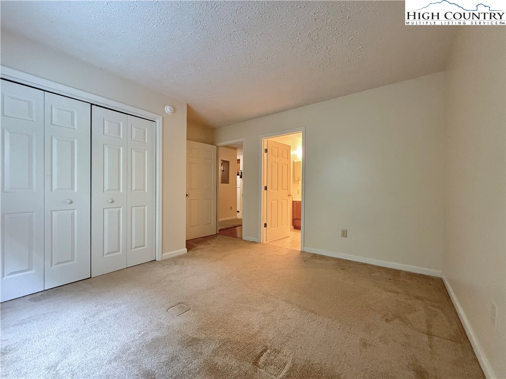 800 Meadowview Drive, Unit 17 Boone, NC 28607 - Photo 17 of 26 an empty room with closet area