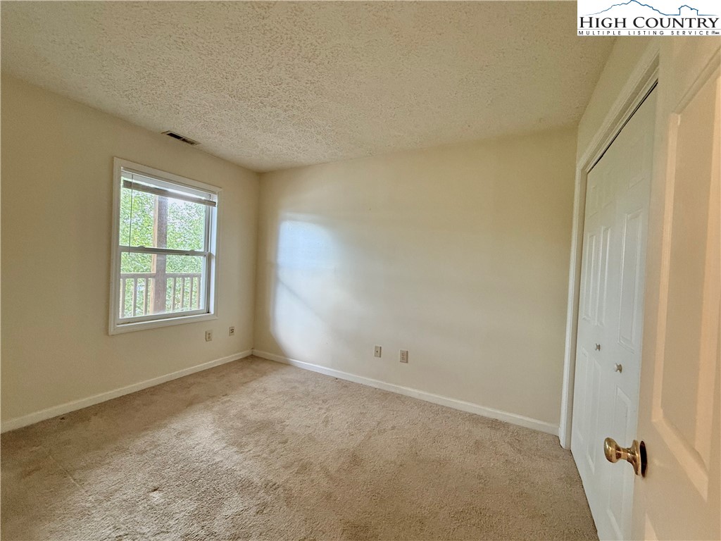 800 Meadowview Drive, Unit 17 Boone, NC 28607 - Photo 24 of 26 a view of an empty room with a window
