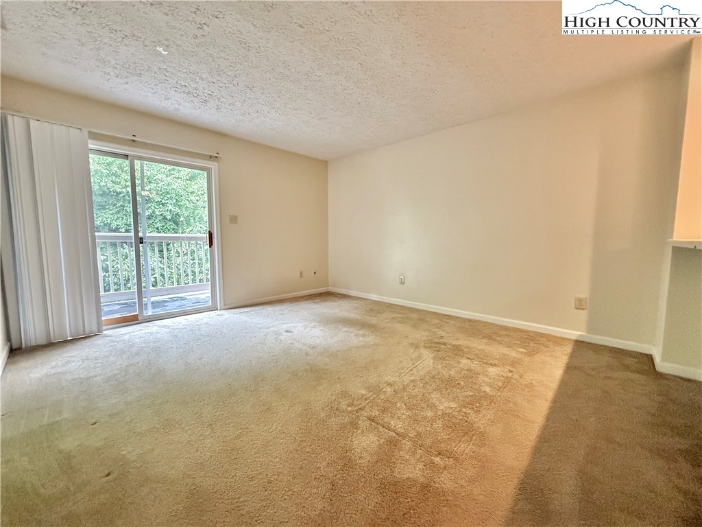 800 Meadowview Drive, Unit 17 Boone, NC 28607 - Photo 8 of 26 a view of an empty room with a window