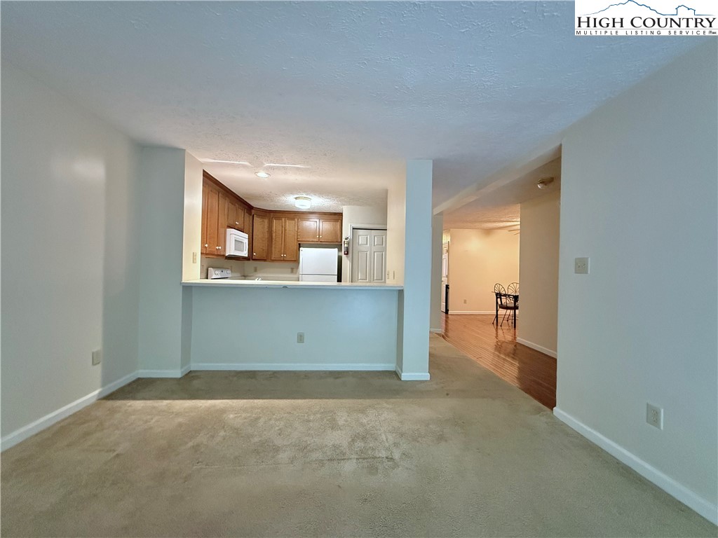 800 Meadowview Drive, Unit 17 Boone, NC 28607 - Photo 10 of 26 an empty room with a bathroom and mirror
