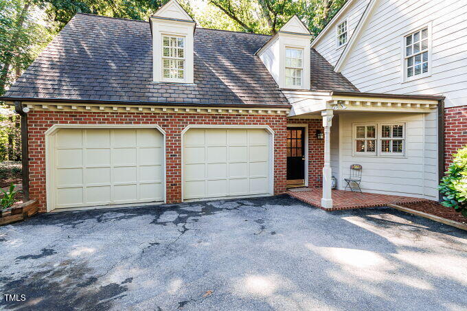 3005 Woodgreen Drive Raleigh, NC 27607 - Photo 4 of 13 a view of a house with a door and wooden fence