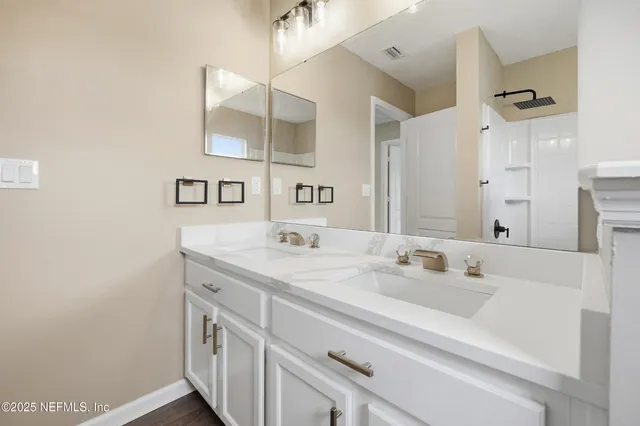 a bathroom with a bathtub and shower