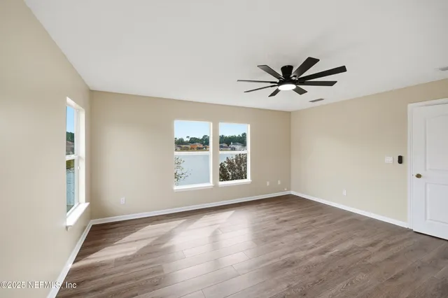 a view of an house with backyard of house