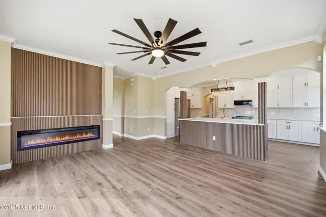a view of kitchen with cabinets and wooden floor