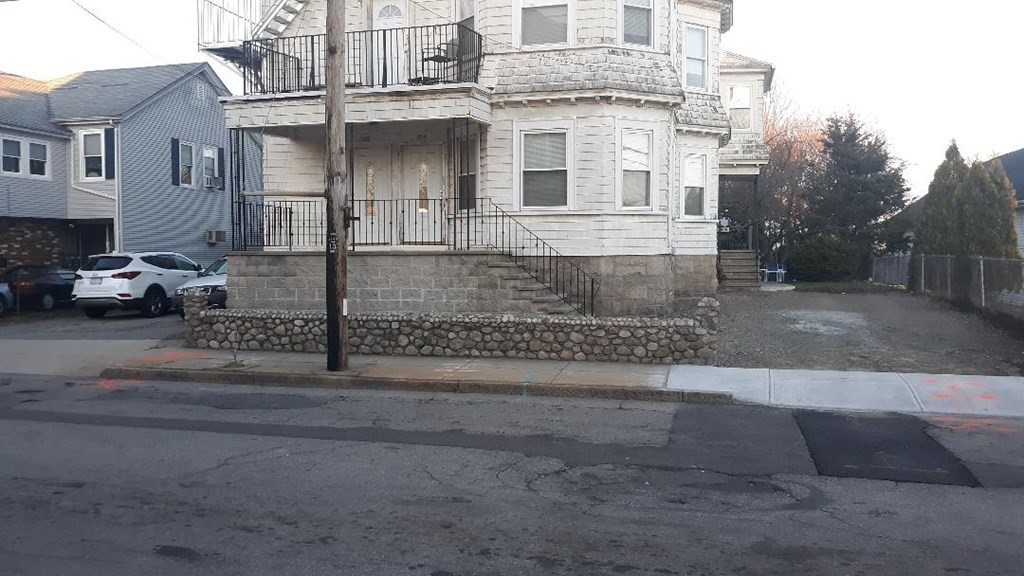 242 Stafford Road Fall River, MA 02721 - Photo 3 of 19 a view of a white house with large windows