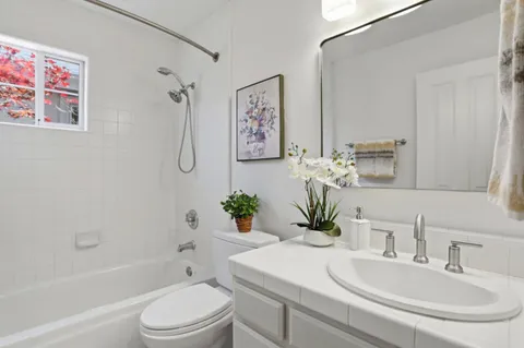 a bathroom with a sink a toilet and a bathtub
