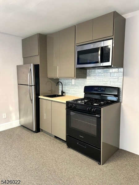 82 Mission Street Montclair, NJ 07042 - Photo 2 of 8 a kitchen with a refrigerator stove and microwave