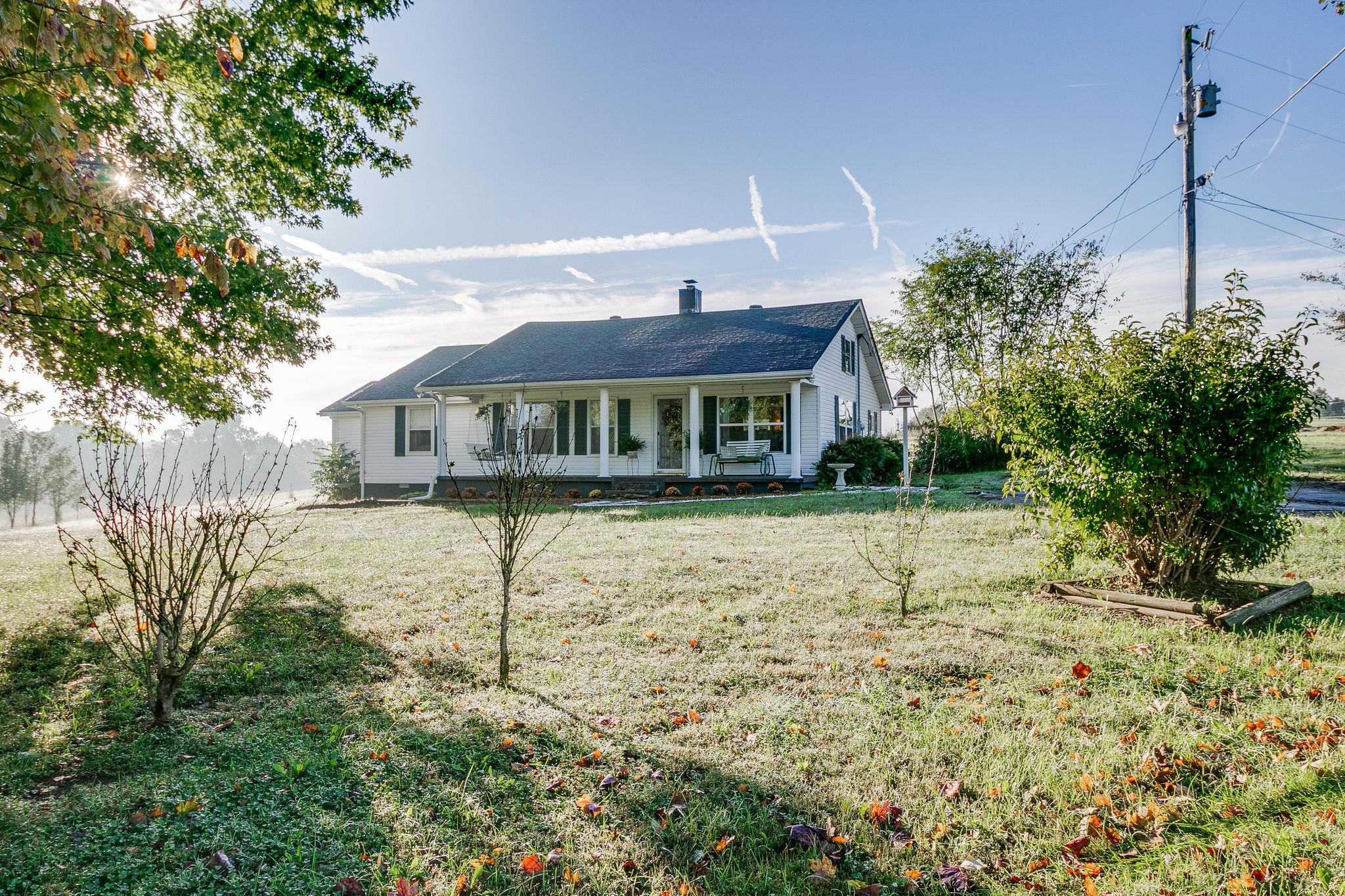 385 Ben Albert Road Cottontown, TN 37048 - Photo 4 of 27 Drink your coffee on the porch as an early morning sun dries the cool autumn dew!