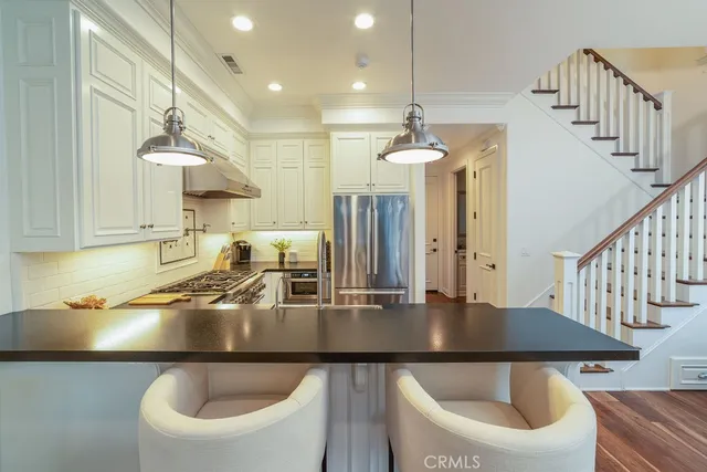 a living room with furniture fireplace and a flat screen tv