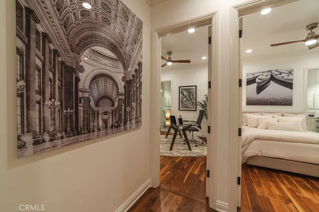 a view of a workspace with furniture and stairs