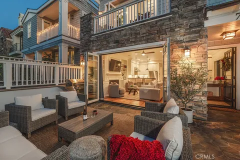 a view of a patio with couches and a potted plant on a table