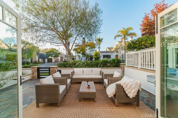 a view of a patio with couches chairs and a fire pit