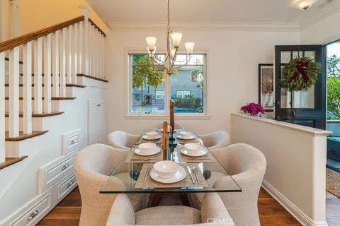 a kitchen with stainless steel appliances a stove a sink and a refrigerator