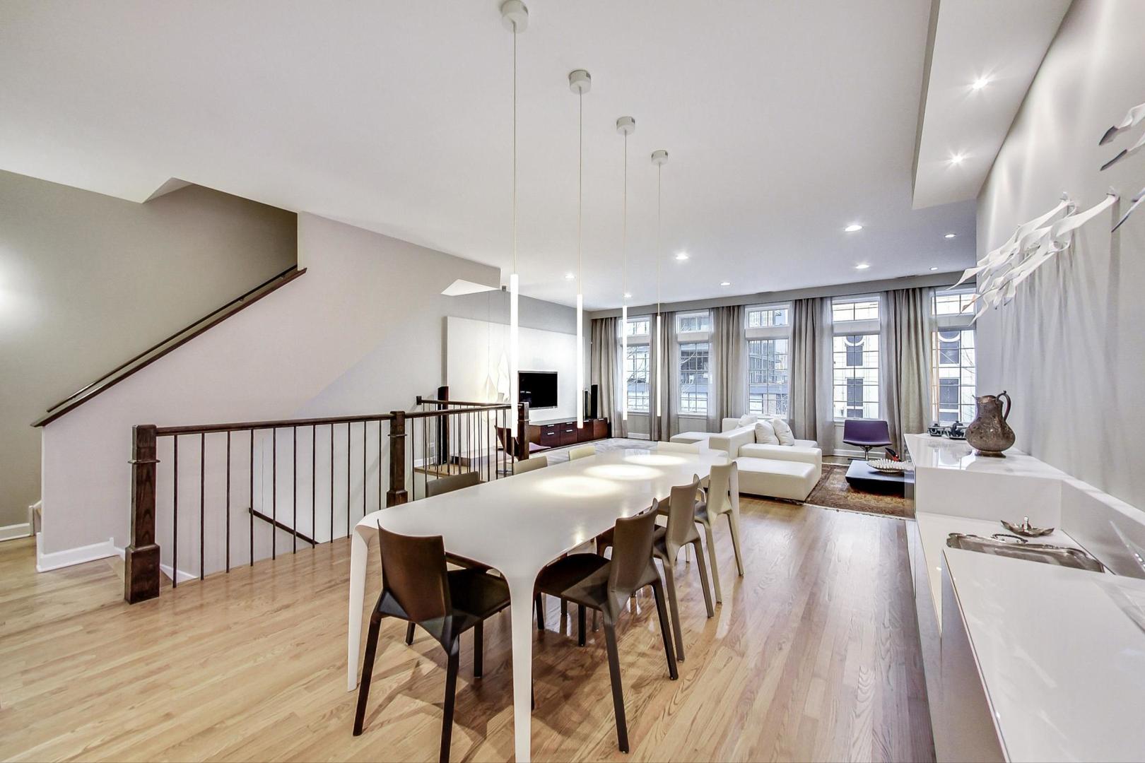 357 West Superior Street, Unit AB Chicago, IL 60654 - Photo 11 of 50 a view of a dining room with furniture window and wooden floor