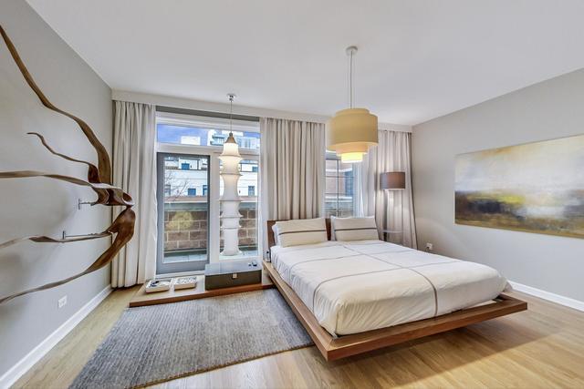 357 West Superior Street, Unit AB Chicago, IL 60654 - Photo 17 of 50 a bedroom with a bed and a window