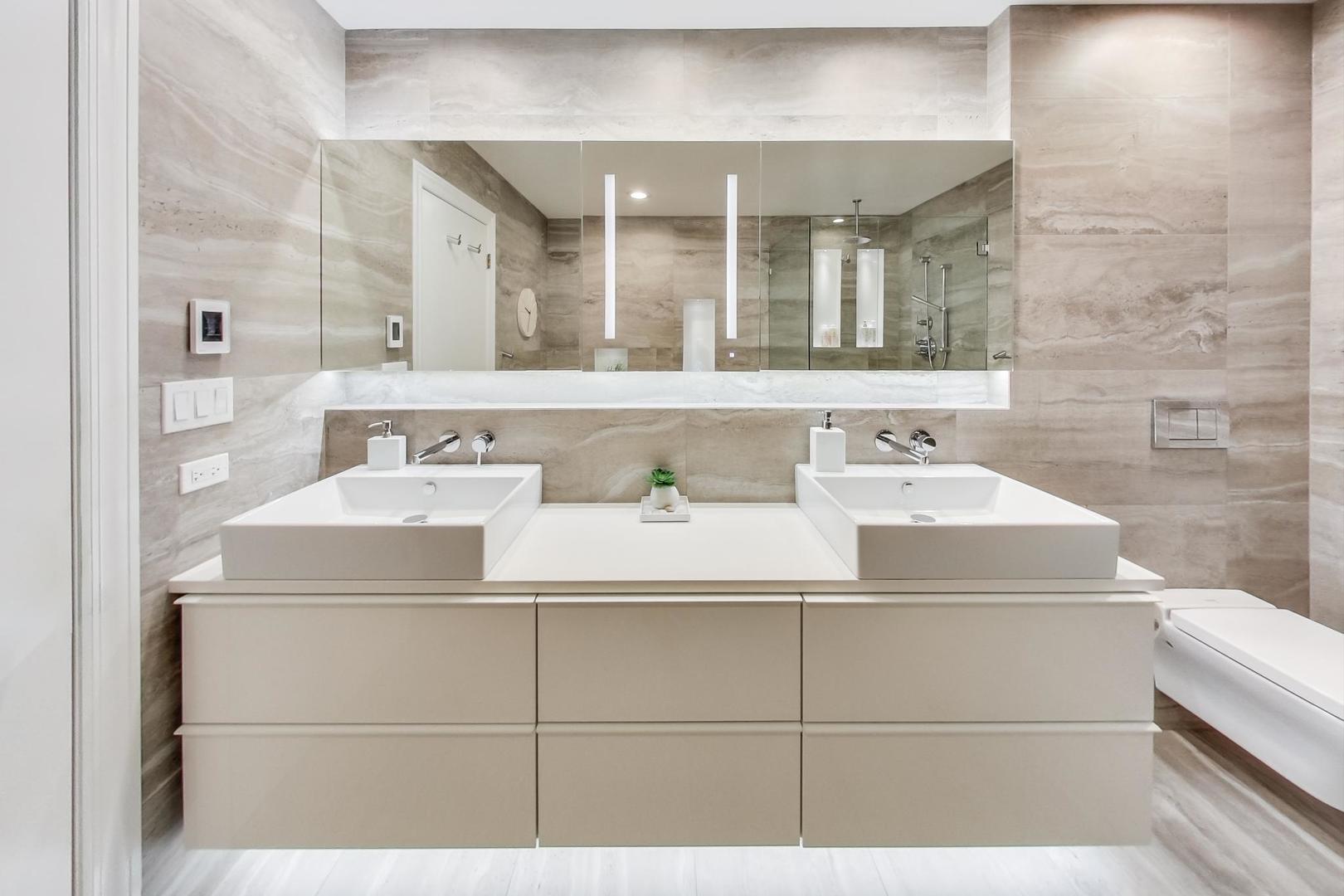 357 West Superior Street, Unit AB Chicago, IL 60654 - Photo 19 of 50 a bathroom with a sink and a mirror