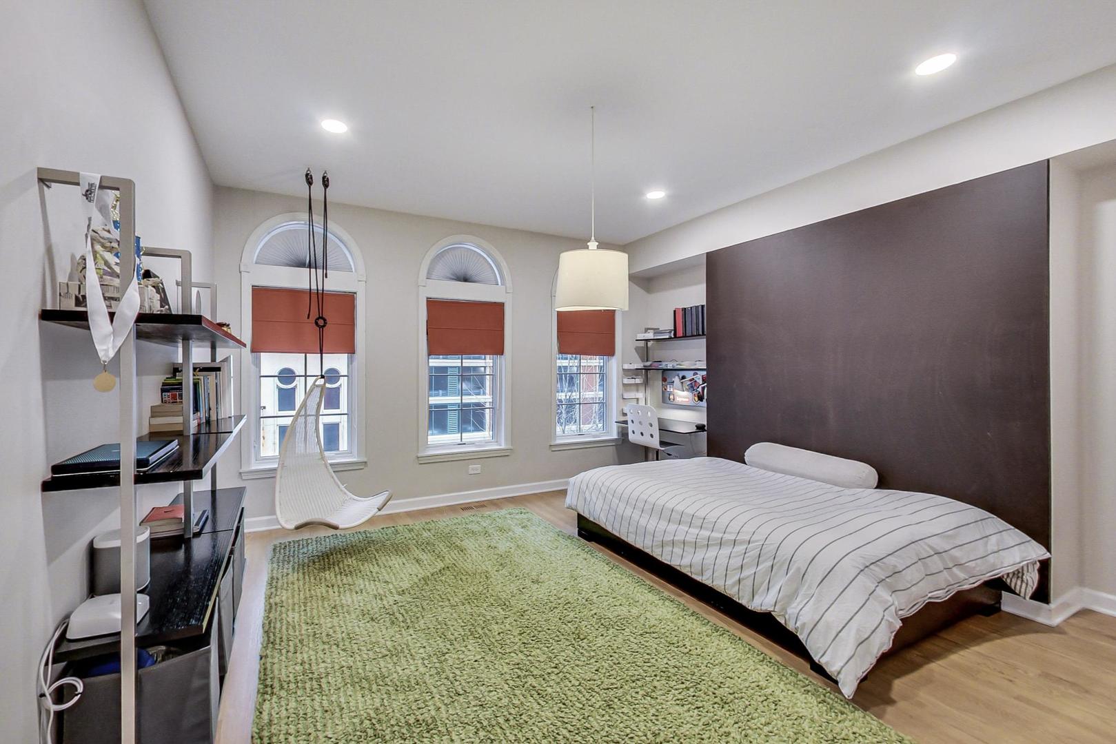 357 West Superior Street, Unit AB Chicago, IL 60654 - Photo 23 of 50 a bedroom with a bed window and walk in closet